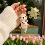 Crochet Otter Keychain – Handmade Amigurumi Otter Bag Charm with Fish - Image 3